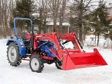 Быстросъемный фронтальный погрузчик с челюстным ковшом